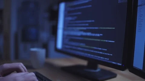 Professional hacker working on the computer at night Stock Footage 75015640