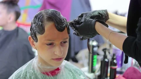 Professional hairdressing in process. close up Stock Footage 164932429