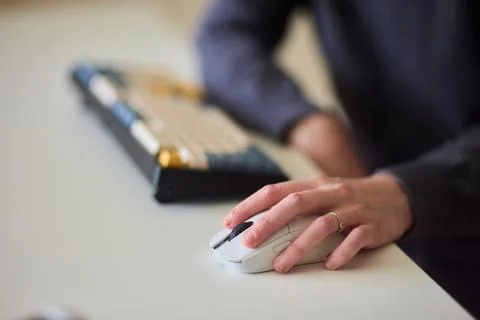 Professional hand controls computer, Worker actively managing digital Foto stock
