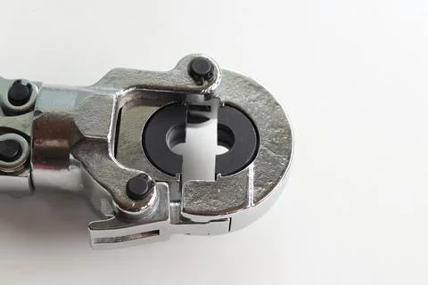 Professional hand-held pipe crimping pliers on a white background Stock Photos