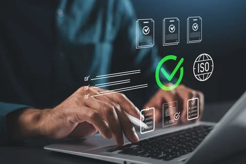Professional hand laptop iso certification document approval quality contro.. Stock Photos