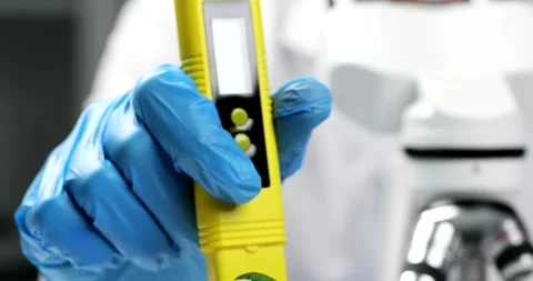 Professional handles digital PH meter testing liquid sample Video stock 308881368