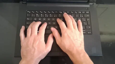 Professional hands typing on black laptop keyboard digital motion footage Stock Footage 339301858