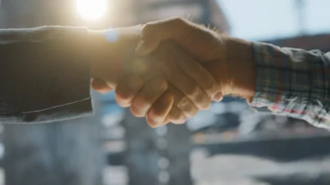 Professional handshake between two construction site workers closing a succ.. Stock Footage 337411804