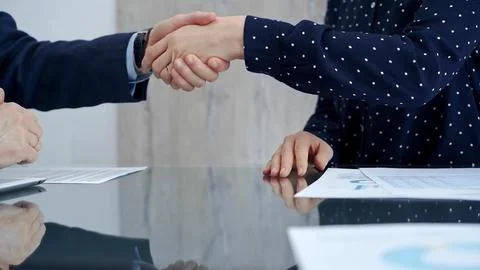 Professional handshake between two professionals and applauds at a corporate Stock Photos