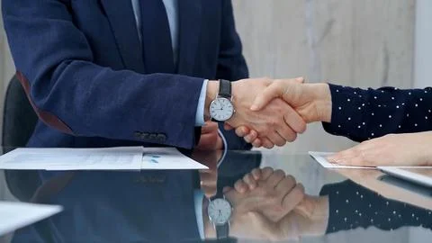 Professional handshake between two professionals and applauds at Stock Photos