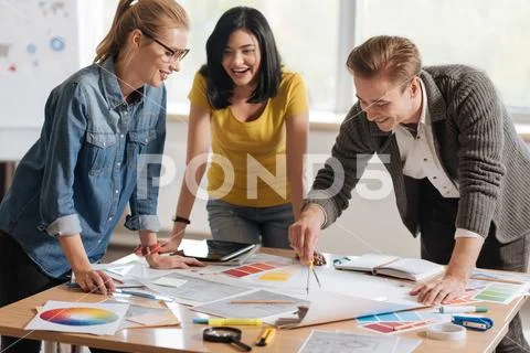 Professional hard working colleagues developing a new design Stock Photos