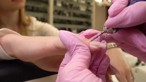Professional Hardware Pedicure Using Electric Machine. The Manicurist Grinded Stock-Footage 128643457