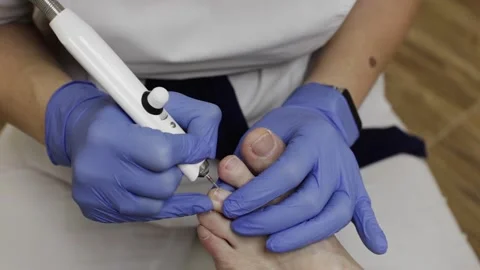 Professional hardware pedicure using an electric device. Stock-Footage 148490239