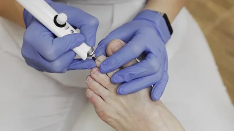 Professional hardware pedicure using an electric device. Stock Footage 148490368