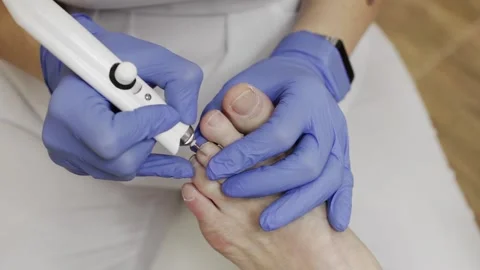 Professional hardware pedicure using an electric device. Stock Footage 148490392