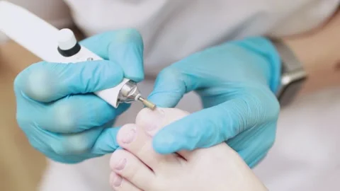 Professional hardware pedicure using an electric device. Stock-Footage 151972415