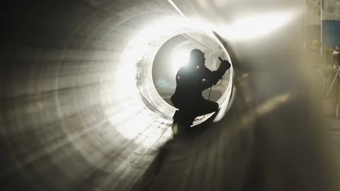 Professional Heavy Industry worker Working Inside Pipe, Wears glasses and Starts Video stock 139189815
