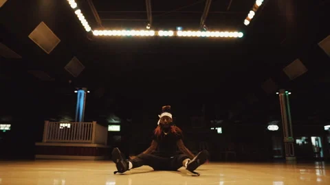 Professional hip hop dancer breakdancing in a dark hall Stock Footage 331597901