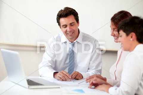 Professional hispanic group working on documents Stock Photos