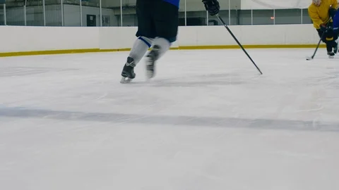 Professional hockey player falling down during game Stock Footage