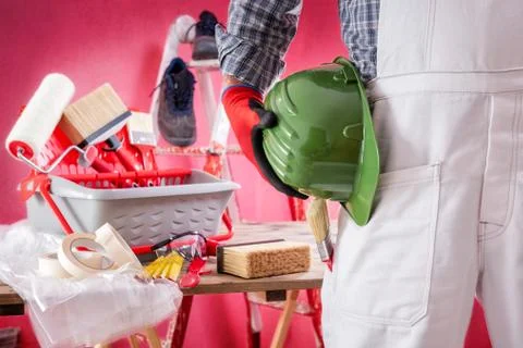 Professional house painter at work on the construction site. Building. Stock-Fotos