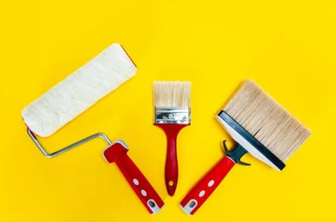 Professional house painter, work tools on yellow background Foto stock