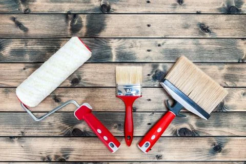 Professional house painter, work tools on wooden background Foto stock