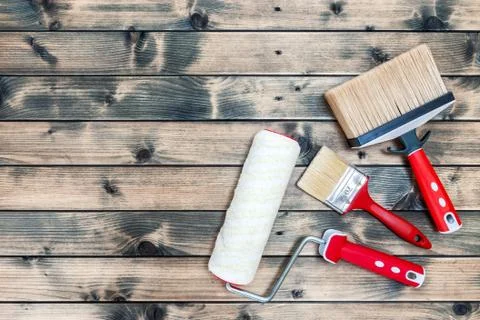 Professional house painter, work tools on wooden background Stock Photos