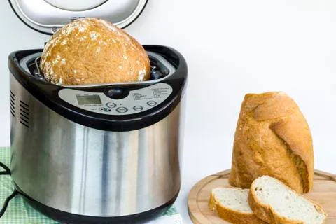 Professional but household bread making machine with breads Stock Photos