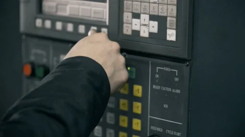 Professional industrial engineer adjusting modern machine settings CNC punching Vidéo 55010848