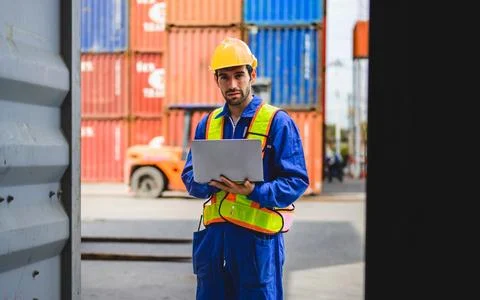 Professional industrial engineer worker working at container cargo yard 写真素材