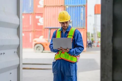 Professional industrial engineer worker working at container yard Stock Photos
