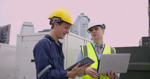Professional industrial engineers are collaborating with digital devices on a... Stock Footage 329498826