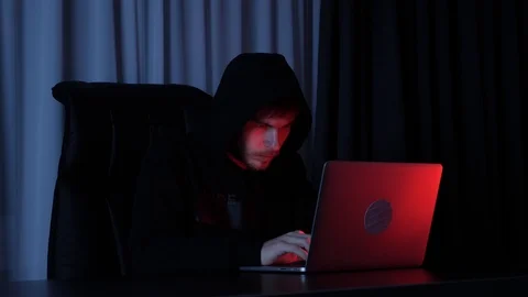 Professional information technology guy typing on laptop. Male hacker in black Stock Footage 125213812