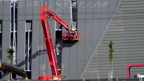 Professional installation work on a construction building site by means of crane Stock Footage 143259919