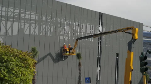 Professional installation work on a construction building site by means of crane Stock Footage 148919262