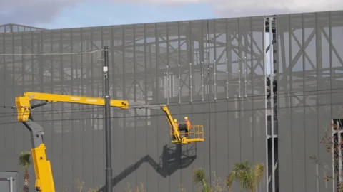 Professional installation work on a construction building site by means of crane Stock Footage 148920271