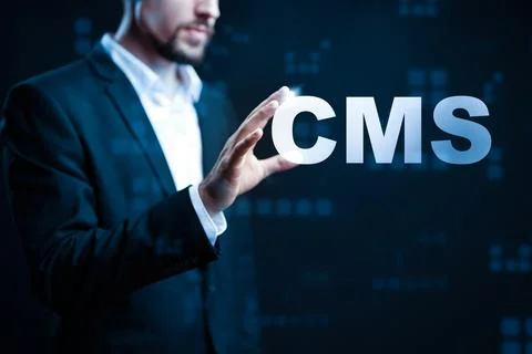 Professional interacts with the digital representation of CMS in a tech setting Stock Photos