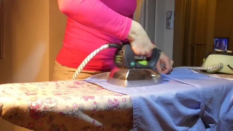 Professional ironing clothes..... Stock Footage 106463063