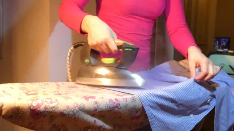 Professional ironing clothes.... Stock Footage 106463130