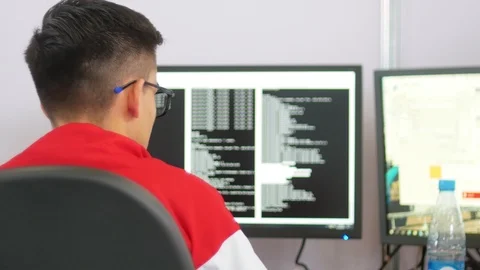 Professional IT programer in glasses working in data center - types the code Stock Footage 115345946