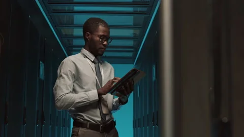 Professional IT Specialist Maintaining Operational Server Racks Stock Footage 149655885