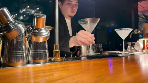 Professional Japanese Bartender Preparing and Serving Cocktails Stock Footage 334833650