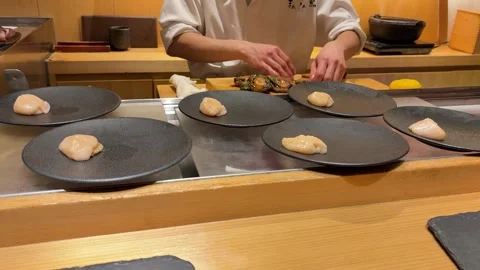 Professional Japanese chef prepping raw seafood on cutting board. Stock Footage 334578168