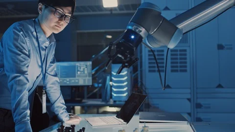 Professional Japanese Development Engineer is Testing an Artificial Intelligence Stock Footage 105349218