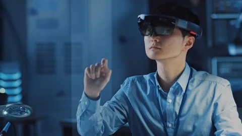 Professional Japanese Development Engineer is Working in a AR Headset Video stock 105354773