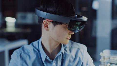 Professional Japanese Electronics Development Engineer in Blue Shirt Wearing VR Stock Footage 105341807