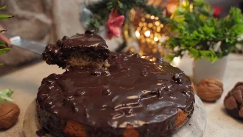 Professional kitchen baker cuts a piece of Wheat cake with a knife Stock Footage 282567294