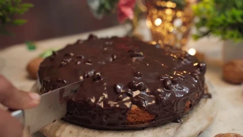 Professional kitchen baker cuts a piece of Wheat cake with a knife Stock Footage 282567327