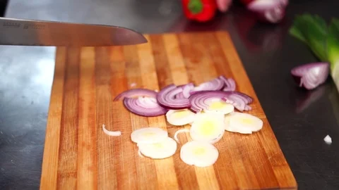 Professional kitchen chef cutting red hot chili pepper in thin slices with sharp Video stock 105455445