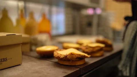 Professional Kitchen In A Hotel Restaurant Close-Up Chef Puts A Piece Of Cheddar Stock Footage 196201295