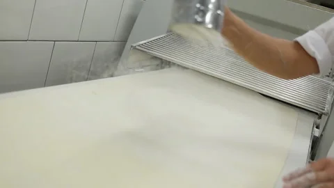 Professional kitchen. Media. Machine for making and broaching dough. The pie Stockbeeldmateriaal 151787268