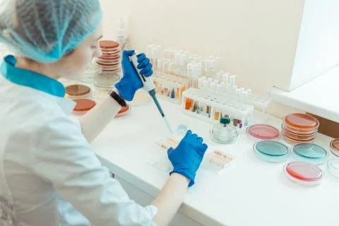 Professional lab worker sitting at the table 库存照片
