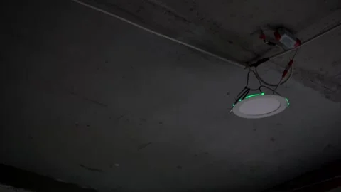 A professional laser level, set up on uneven concrete framed by the unfinished Stock Footage 309219060